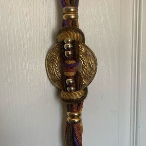 BELT..VINTAGE GOLD(BRASS) MEDALLION WITH OLIVE GREEN PURPLE GOLD BROWN ROPING